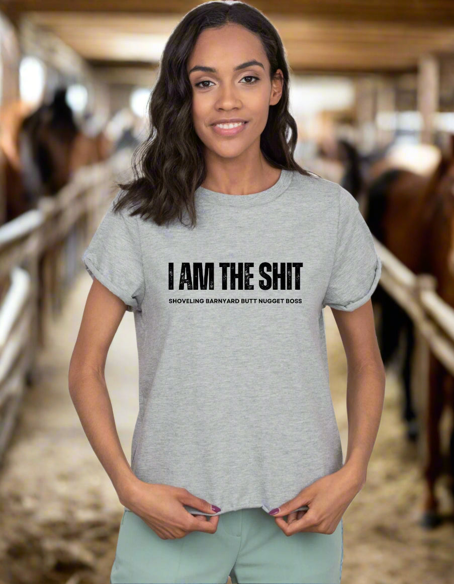 Woman wearing a t-shirt in a barn
