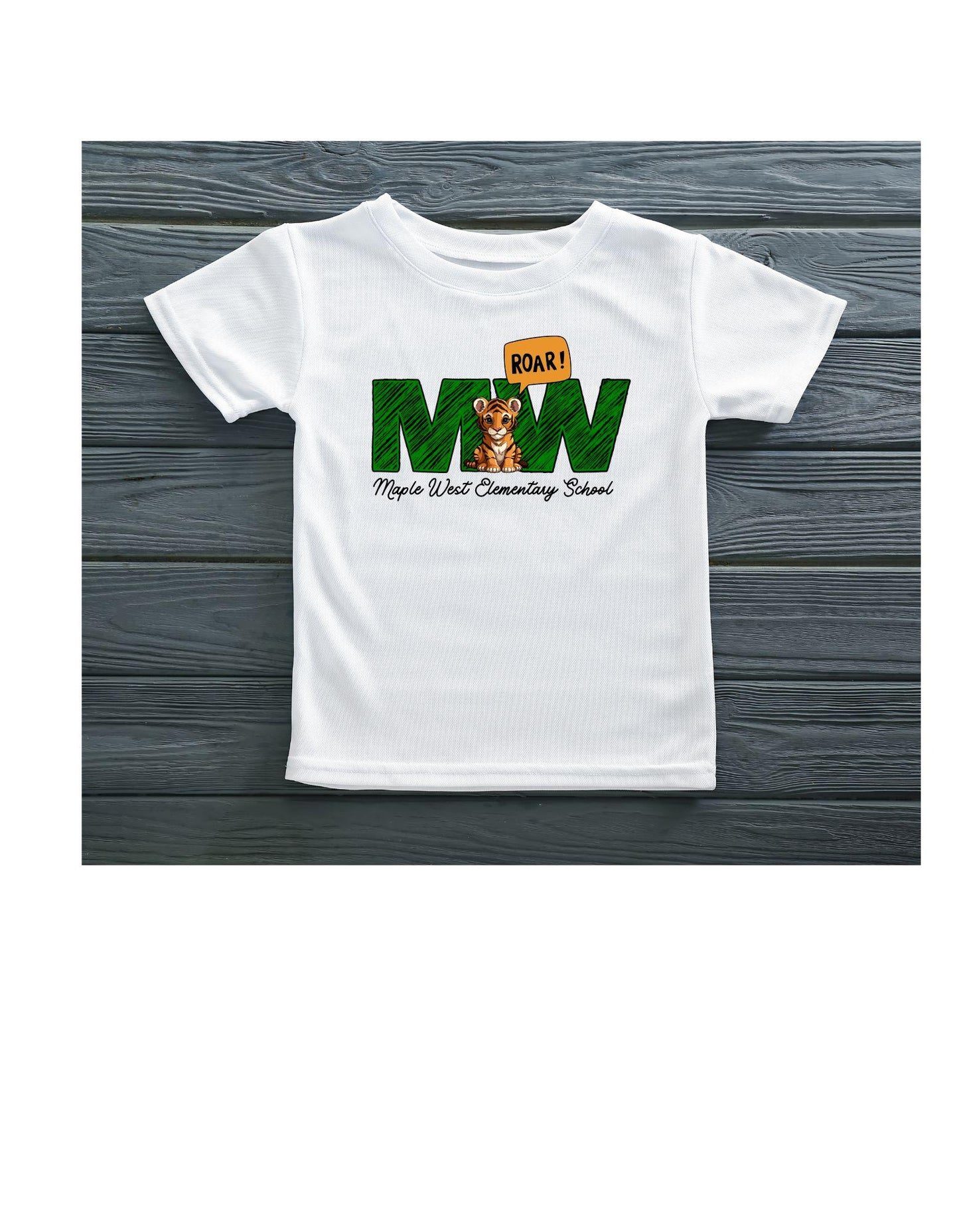 White t-shirt with 'Roar! Maple West Elementary School' design on a wooden background