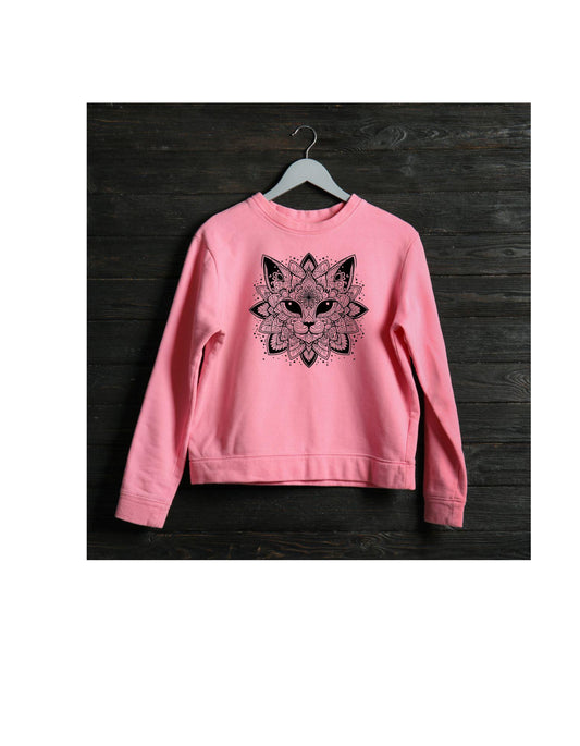 Pink sweatshirt with a black fox design on a wooden surface