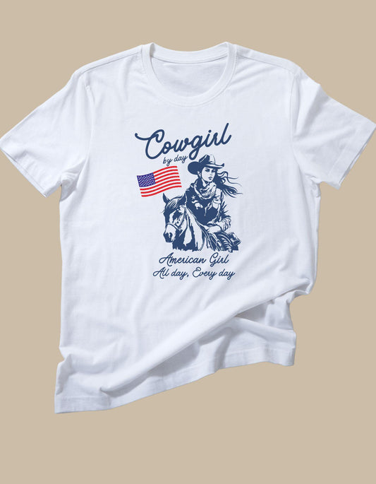 White t-shirt with a graphic of a cowgirl and text on a beige background