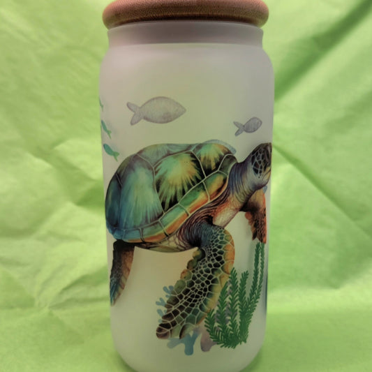 Frosted glass beer can shaped like a turtle with a turtle and underwater scene, complete with fish and aquatic plants.